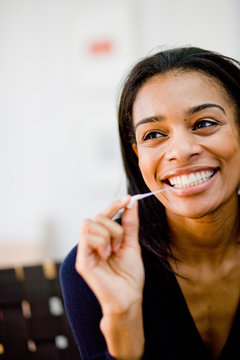 Woman playing with chewing gum