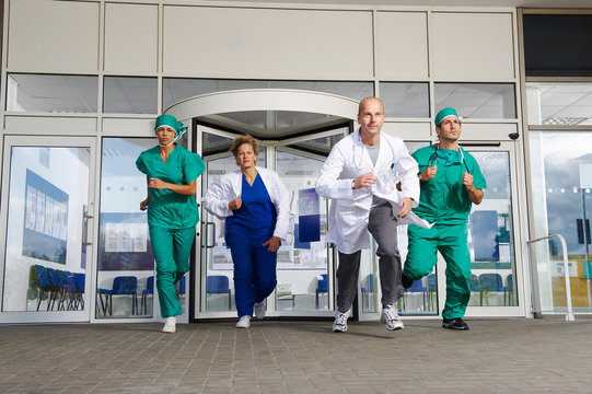 Medical Team Rushing Out Of Door