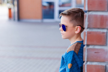 Portrait of a beautiful young boy outdoors