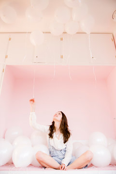Girl playing with balloons