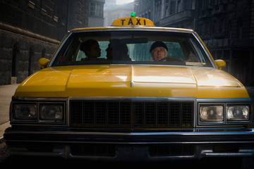 Taxi Driver Glancing at clients