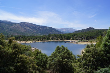 Fototapeta na wymiar The El Burguillo Reservoir is located along the Alberche river in the province of Ávila, Spain, between the municipalities of El Tiemblo and El Barraco.