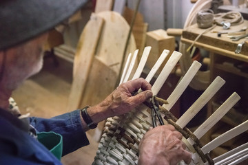 Craftsman at work in the dolomites village, Villabassa, South Tyrol, Italy