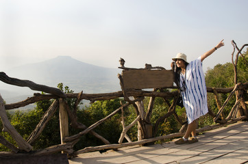 Fototapeta na wymiar Thai women people travel and posing on top of Phu Pa Po mountain or Fuji City Loei