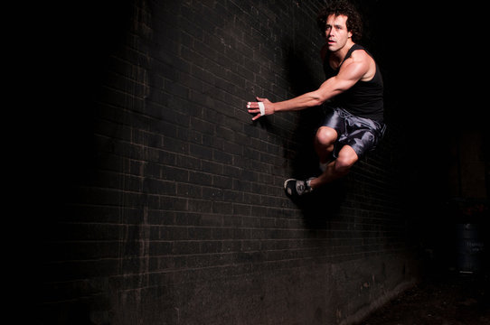 Runner bouncing off side of wall