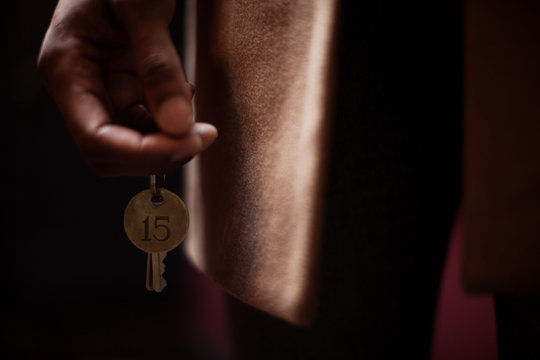 Man holding hotel room key