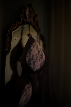 Lace bra hanging on mirror