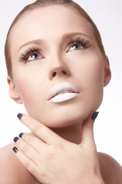 Young woman wearing white lipstick
