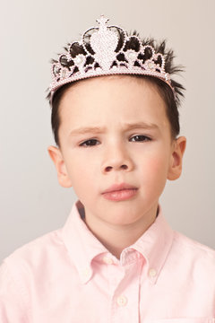 Portrait of a boy wearing a tiara