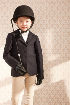 Girl wearing equestrian uniform