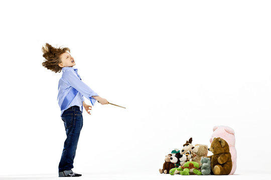 Boy pretending to be musical conductor