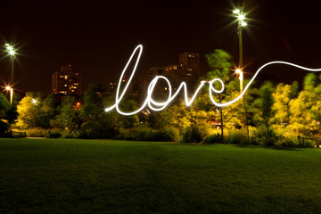 Love written by light trail at night