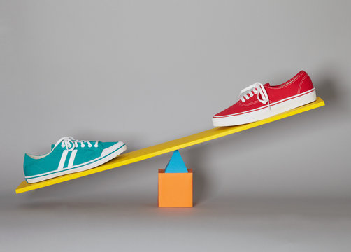 Trainers on a pair of scales