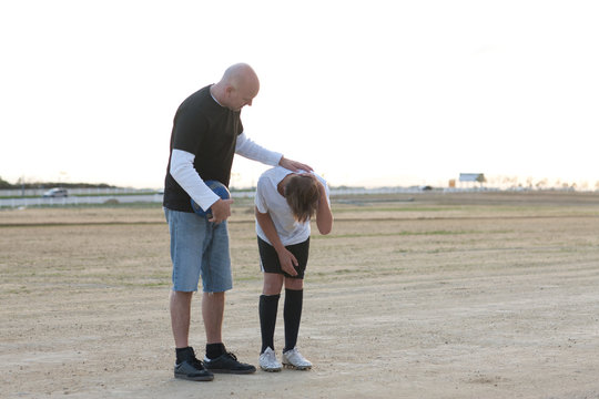Man looking after injured boy