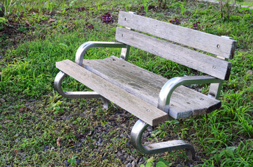 Wooden bench on grass