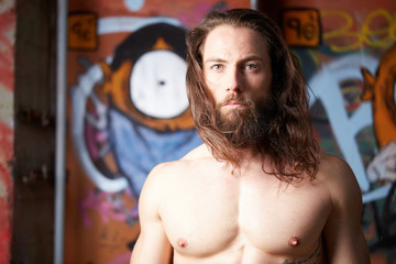 portrait of young bearded long haired man