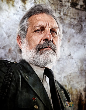 Portrait of senior man wearing military uniform