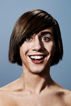 Smiling young man with bobbed hair
