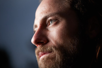 portrait of young bearded long haired man