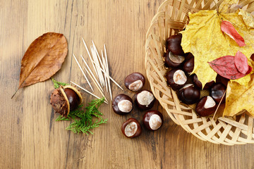 tinker utensils in autumn for decoration and chestnut figures