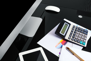 computer pen and notebook on the bleck table