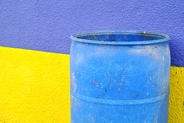 yellow wall and blue and blue bin