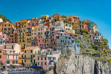 Fototapeta na wymiar View of the colorful city of Manarola in the Gulf of Five Lands in Italy
