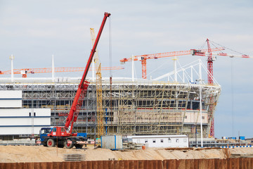 Cranes at work . Stadium construction. construction of sports facilities