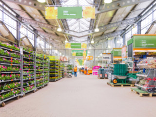 blurred hardware store shelves with seeds