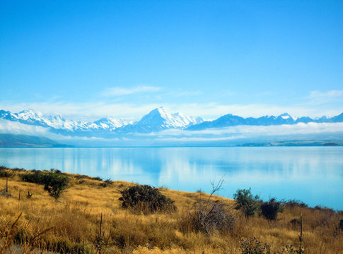 Mount Cook reflecting in Lake Pukaki, New Zealand - Stock Photo