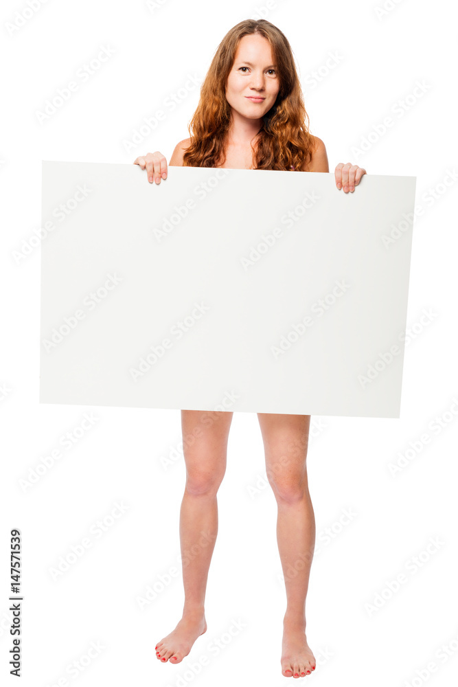 Wall mural barefooted naked woman hiding behind a white billboard in the studio