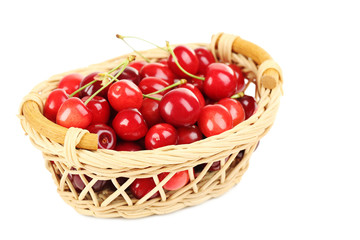 Ripe cherries in basket isolated on a white background