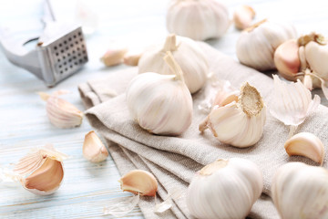 Garlic with napkin on blue wooden table