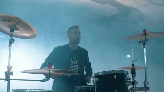 Young rock and roll drummer performance underground in slowmotion