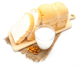 Fototapeta na wymiar Sliced bread and milk with almond isolated