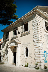 Abandoned dirty demolished building, one of hotels in Kupari complex near Dubrovnik city