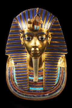 Replica of funerary mask of Tutankhamun. Isolated on black background. The same or very similar to the original