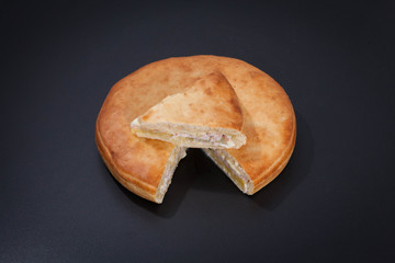 Cooked pie Kournik on a chalkboard