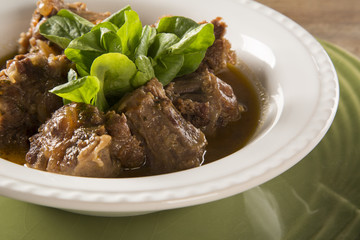 Brazilian traditional food called oxtail with arugula