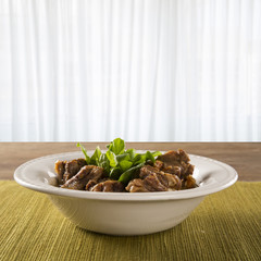 Brazilian traditional food called oxtail with arugula