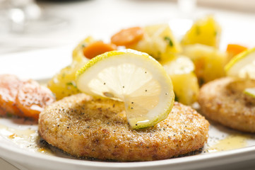 Fish Cake served on plate with lemon