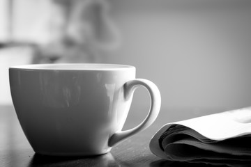 Cup of coffee on wooden table