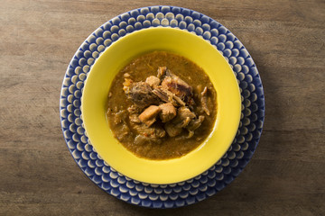 Fish pirão with pieces of chicken from angola