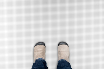 Brown shoes standing on blur floor