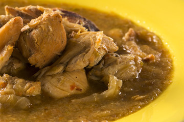 Fish pirão with pieces of chicken from angola