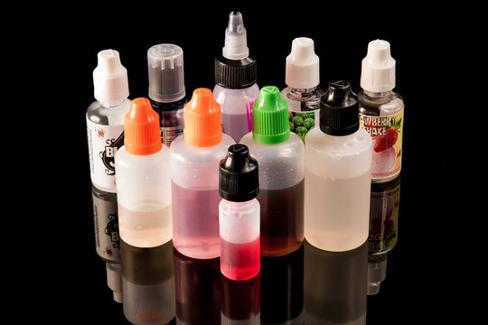 10 E-juice bottles on a black backdrop