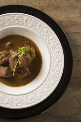 Rustic Stew meat with sauce in the white plate