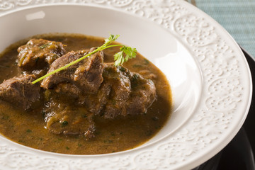 Rustic Stew meat with sauce in the white plate