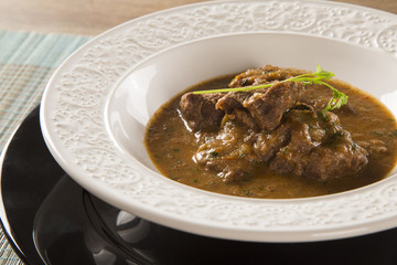 Rustic Stew meat with sauce in the white plate