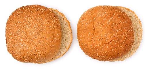 Pair of hamburger buns sprinkled with sesame seeds isolated on a white background. Close up. Top view.